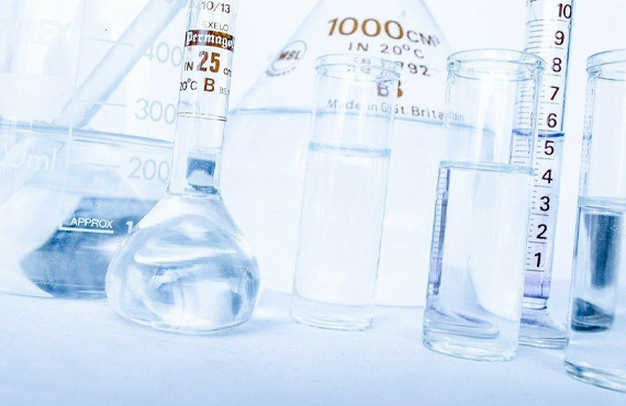 clear glass measuring cup on white table