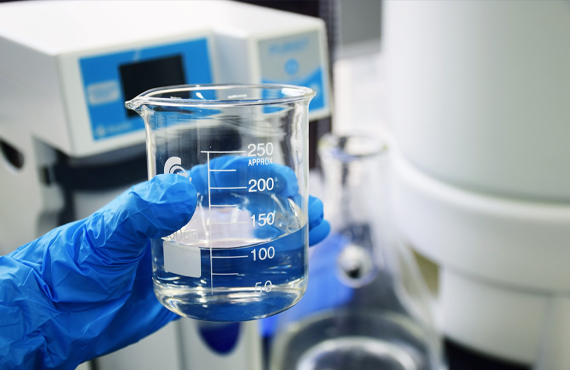 clear glass measuring cup on white table