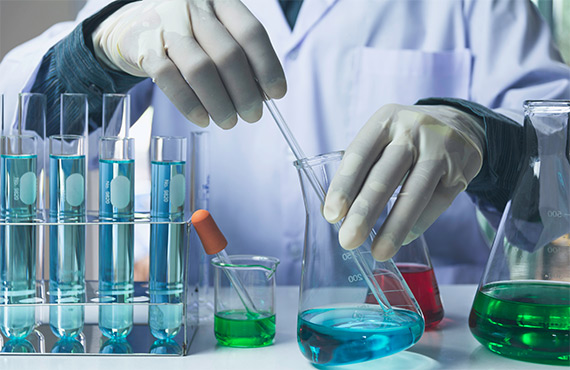 three clear beakers placed on tabletop